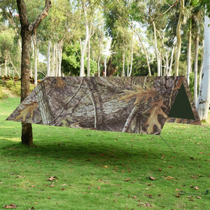 Bâche militaire camouflage en forêt